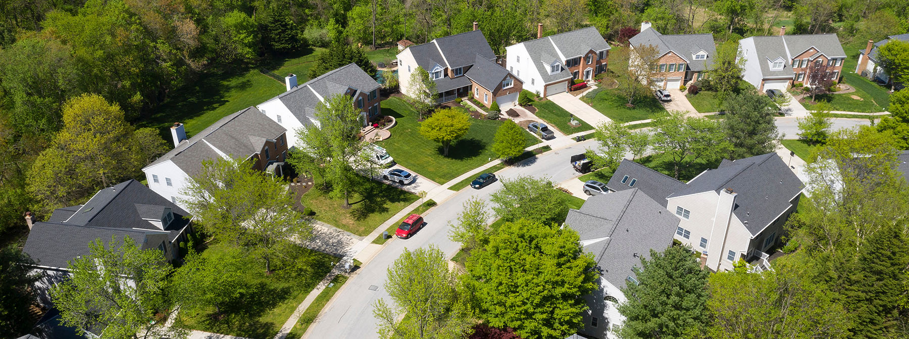 Aerial view of suburban homes in forest area